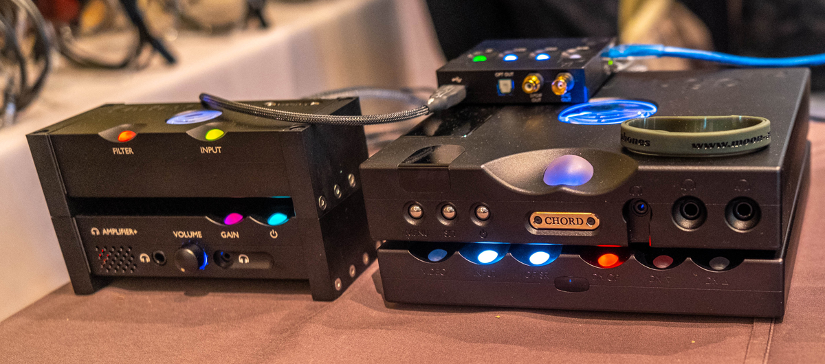 Chord's Qutest DAC $1945 and their $1795 Annie Desktop Integrated Headphone Amp, from the mind of Rob Watts, could also drive small speakers. Next to it we see the Chord 2YU Digital Interface $745, Hugo TT 2 DAC & Headphone Amplifier $5995, and Hugo M Scaler $5295.